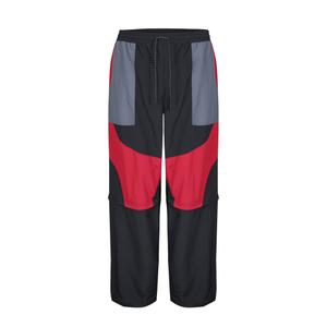 1222970-60-0-83-pantaloni-umbro-zip-of-l-fit-black-red-dahila-iron